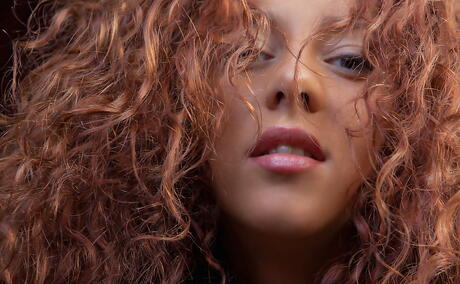 Slender red-haired teen Louisa A reveals tiny tits and spreads her legs 