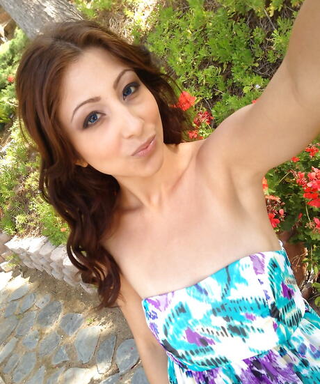 Superb american babe Alexa Rydell exhibits her butt in skirt and spreads her legs outside