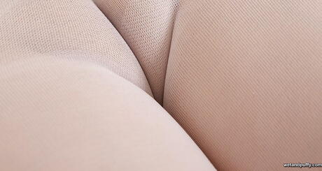 Deluxe brunette babe Ella Martin reveals her butt in hot pantyhose and playing with dildo 