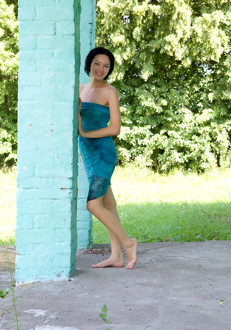 Very attractive dark hair young Loreen A exhibiting big knockers and spreading her legs outside