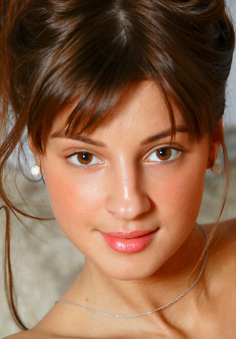 Stunning dark-haired young Melena A uncovers tiny tits and bald pussy 