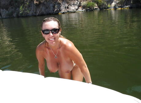 Hot american wife Sandra Otterson exposes big tits and sexy butt outside