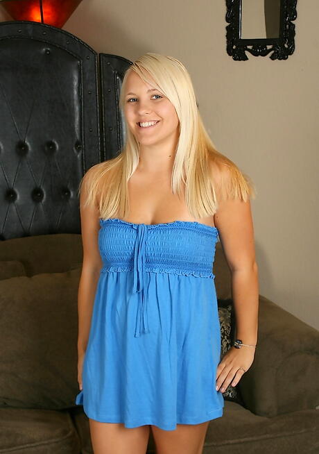 Sexy blond teen Naomi exposes small tits and shaved pussy 