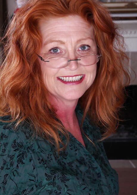 Excellent british red-haired mature Veronica Smith exposes big boobs and shaved pussy 