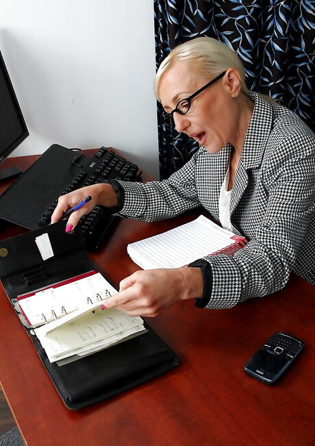 Curious mature Tina in underwear exposing big hooters and masturbating in office