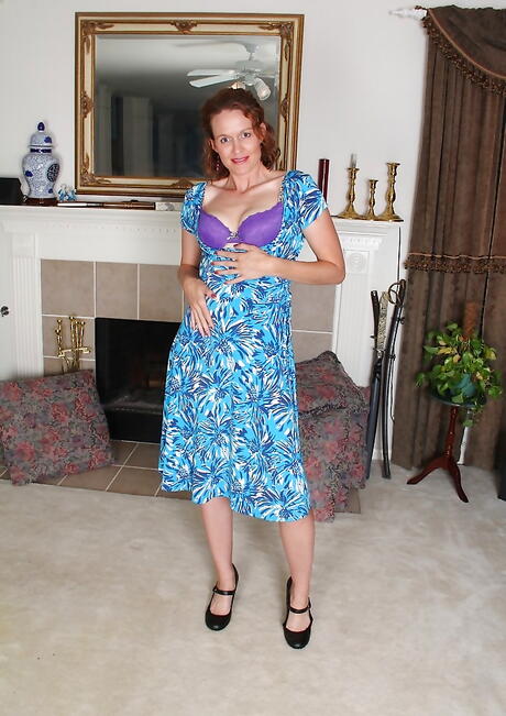 Very attractive mature Ajia Simpson in sexy skirt exposes her butt and spreads her legs 