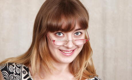 Attractive babe Emily Johnson in fancy skirt bares big titties and spreads her legs 