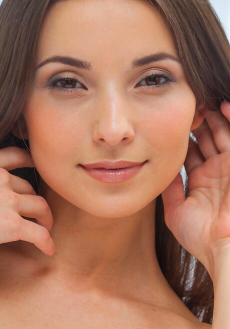 Svelte dark-haired young Breann showing big titties and shaved pussy 