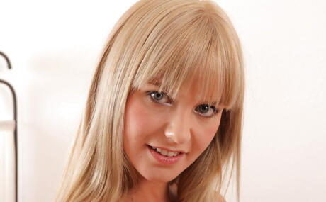 Excellent latin blonde milf Bella Baby exhibiting big hooters and shaved pussy 