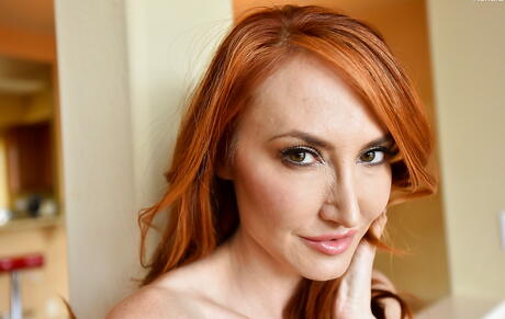 Sexy american redhead milf Kendra James showing big hooters and pussy 