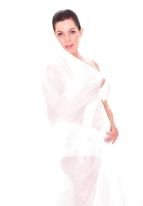 Attractive dark-haired mature Magdalene St. Michaels reveals big boobies and hot butt 