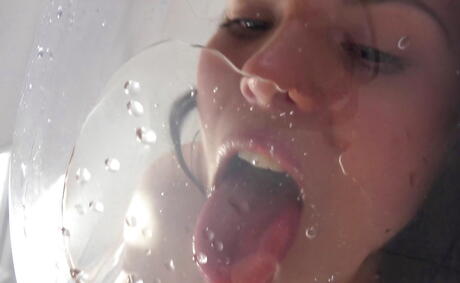 Sexy dark-haired hottie Ella Martin uncovers tiny tits and shaved pussy in the bathroom