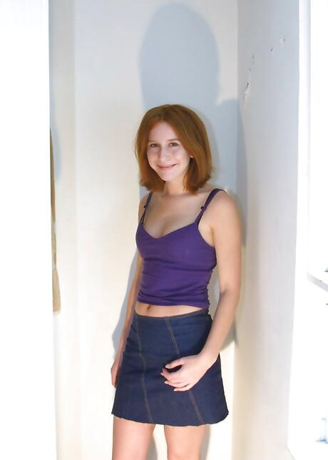 Excellent youthful Kira Milan in skirt shows her butt and spreads her legs 