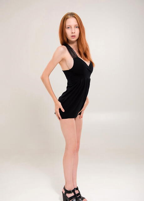 Rangy redhead youthful Ms White-kitten baring big boobies and spreading her legs 