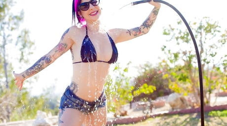 Glamorous american milf Joanna Angel denudes big titties and ass outside