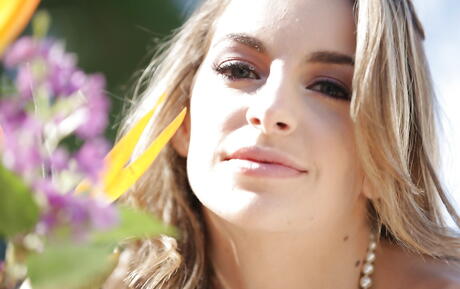 Slim american pornstar Kimmy Granger exhibiting tiny tits and spreading her legs outside