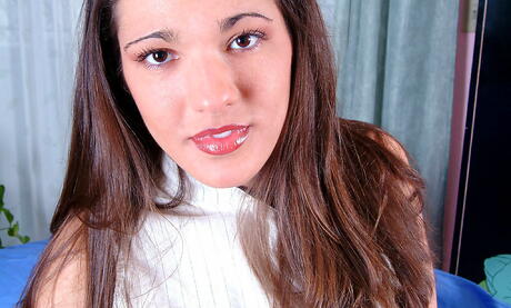 Foxy brunette young Mia denudes big boobies and spreads her legs 