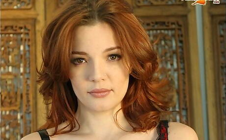 Peachy british redhead Danielle Riley in sexy posing gallery