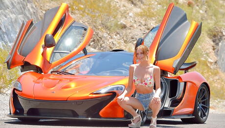 Luscious american blond teen Anya Amsel in sexy shorts shows big titties and plays with dildo outside