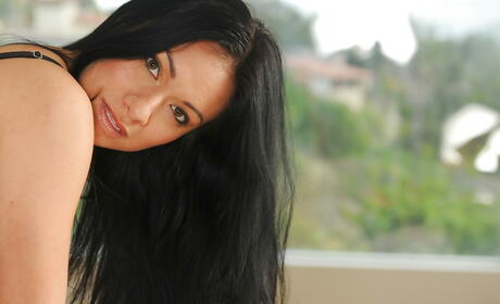 Superb latin milf Eva Estrella bares her ass in sexy jeans and spreads her legs in kitchen