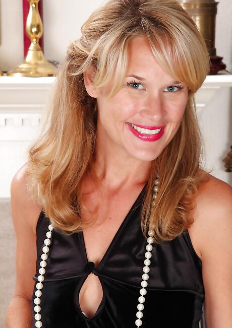 Slim blonde milf Katherine Jackson bares small tits and spreads her legs 