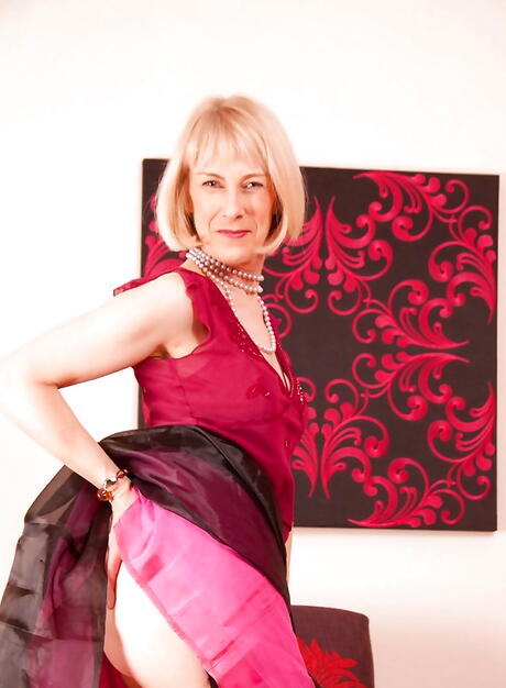 Curious mature Hazel in hot lingerie revealing big knockers and toying her cunt 