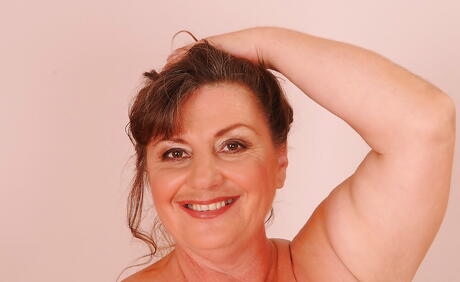 Delightful older Goca showing big knockers and spreading her legs 