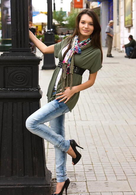 Hot brunette youthful Leila A in tight jeans uncovering small tits and hairy pussy outdoor