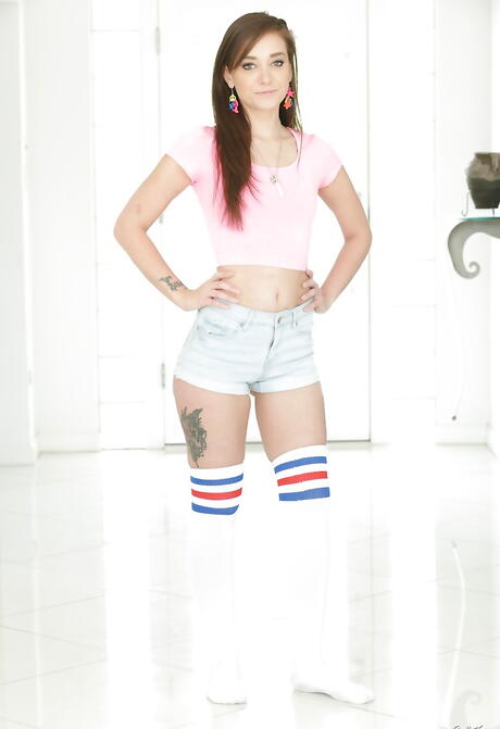 Very attractive american dark-haired young Gia Paige in shorts bares small tits and pussy 