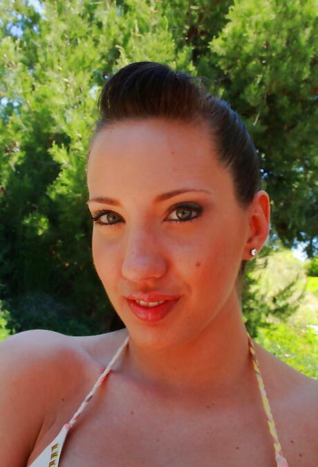 Very attractive american milf Kelly Divine exposing big hooters and sexy butt outside