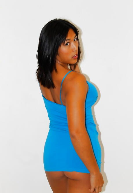 Delightful asian dark hair cutie Mai Li in nice skirt showing big titties and ass 