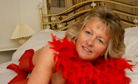 Enticing older Colleen in hot lingerie showing her beauty