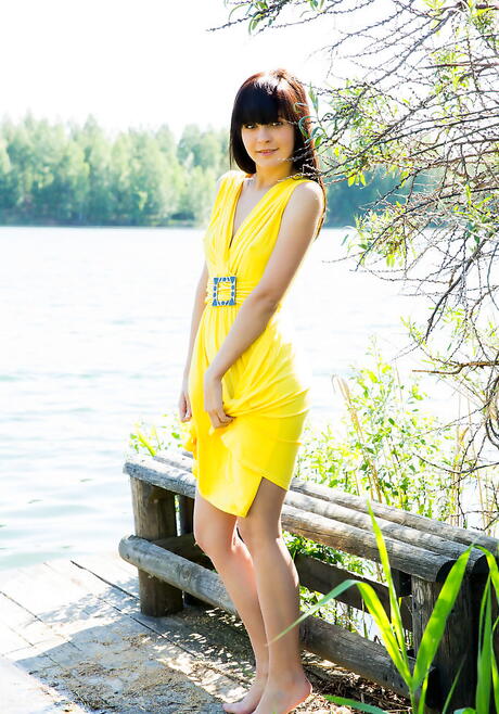 Luscious dark-haired young Zelda B in fancy skirt baring her ass and spreading her legs outdoor