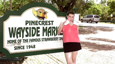 Voluptuous american milf Desirae in nice skirt exposing big knockers and spreading her legs outside