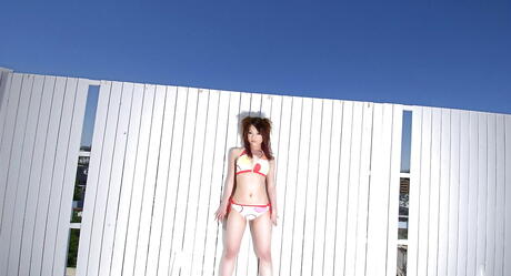 Slim japanese teen Mai Kitamura in hot bikini bares big boobies and spreads her legs 