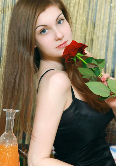 Stunning ukrainian dark-haired young Marta E shows big boobies and bald pussy 