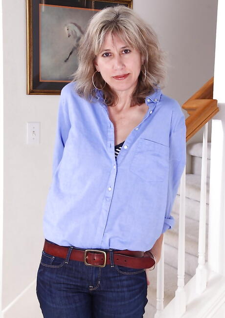 Sultry mature Olive Jones baring small tits and hairy pussy 