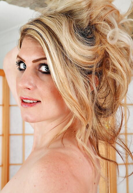 Hot british blond older Ashleigh Mckenzie in lingerie revealing her butt and spreading her legs 