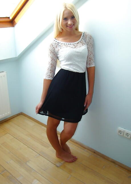 Svelte blond young Carrie in sexy underwear exhibits big tits and shaved pussy 