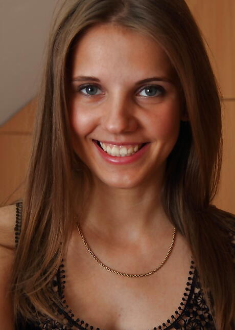 Slender teen Kira bares tiny tits and shaved pussy 