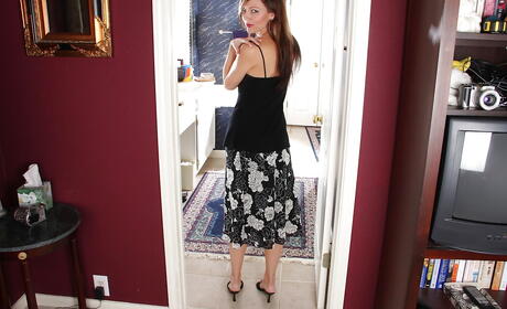 Slender british milf Amy Johnson in nice skirt uncovers small tits and spreads her legs 