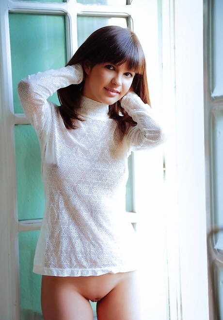 Gracile brunette teen Zelda B revealing big titties and bald pussy 