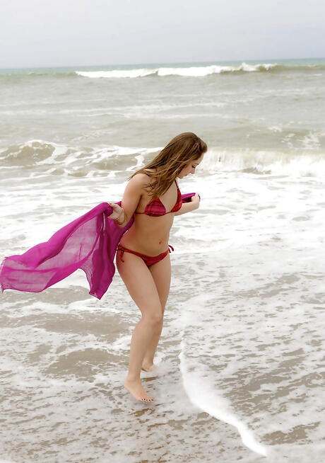 Stunning hottie Remi Lacroix exhibits her ass at beach