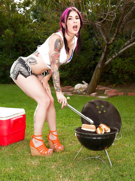 Stunning american milf Joanna Angel in fancy shorts exhibiting her ass and spreading her legs outdoor