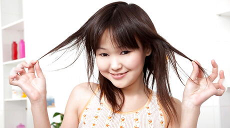 Foxy oriental brunette teen Aliona in softcore shooting in shower