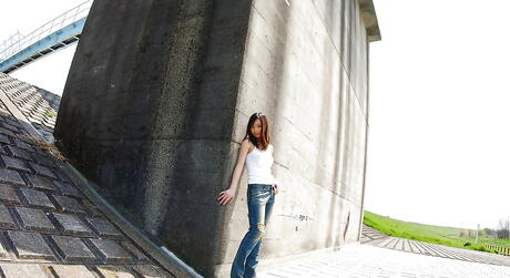 Shapely japanese teen Hikaru Koto in jeans shows big hooters and sexy butt outside