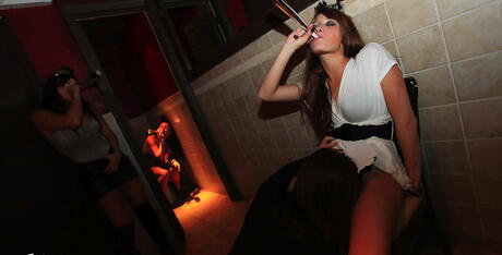 Drunk lesbian girlfriends playing in night club toilet