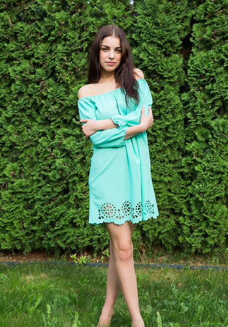 Slender ukrainian brunette young Evita Lima in fancy skirt loves foot fetish outdoor