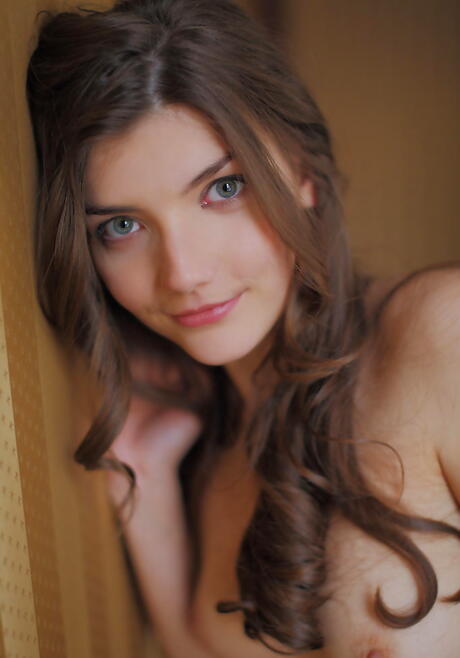 Gracile dark-haired teen Ryanel A exposes small tits and spreads her legs 