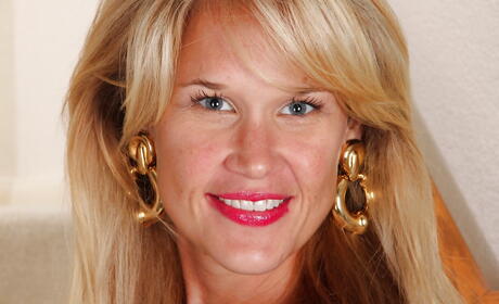 Superb blond mature Katherine Jackson in nice skirt reveals her ass and hairy pussy 